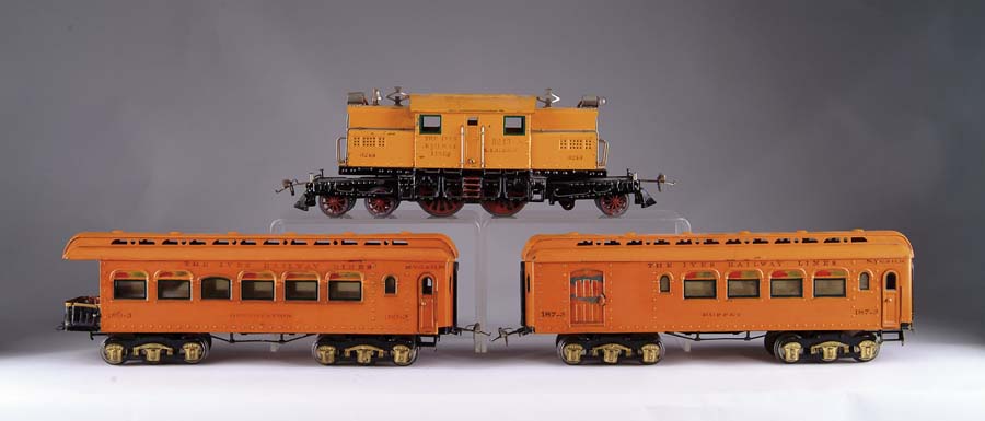 Appraisal: IVES STANDARD GAUGE ELECTRIC LOCOMOTIVE WITH TWO CARS This twelve-wheeled