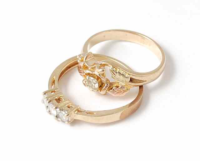 Appraisal: TWO DIAMOND AND TEN KARAT GOLD RINGS one set with