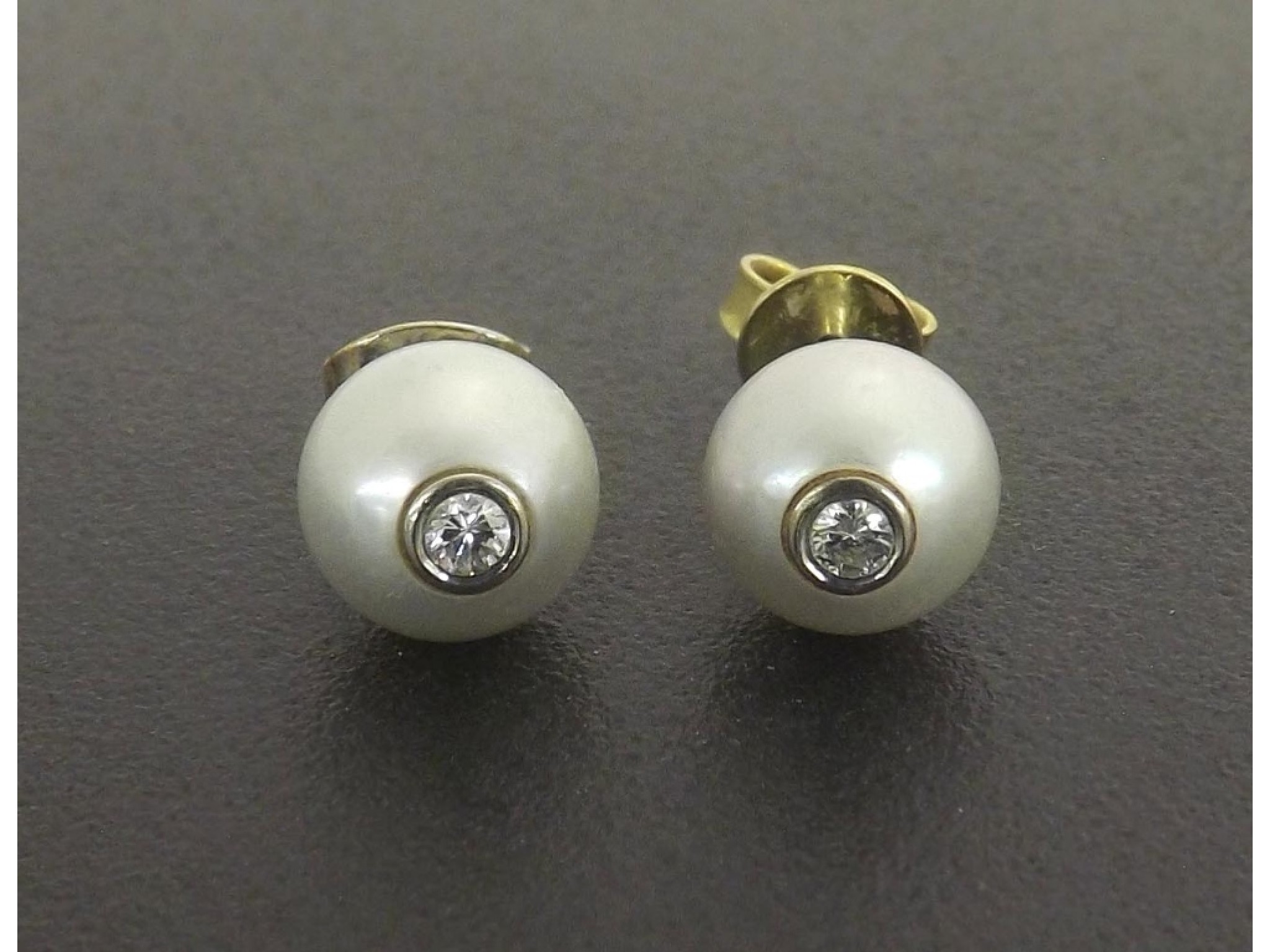 Appraisal: - -a Pair of diamond and cultured pearl stud earrings