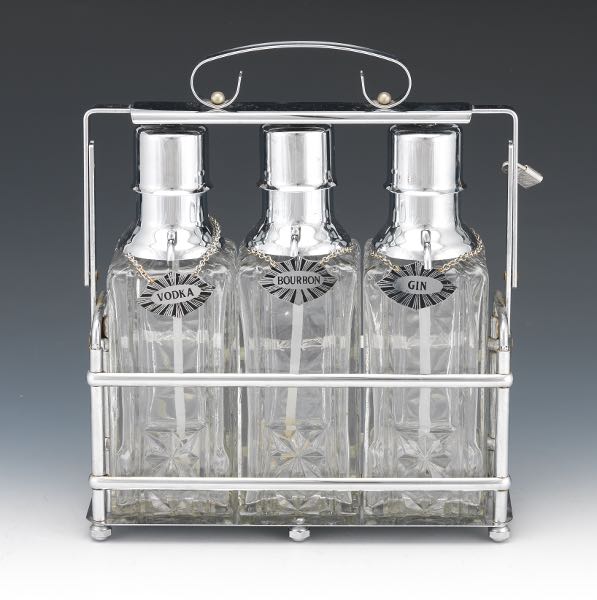 Appraisal: Tantalus Silver Color Metal Three Glass Decanters with Labels in