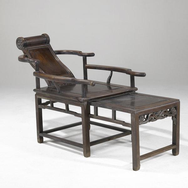 Appraisal: CHINESE FURNITURE Reclining armchair in teak with pullout foot rest