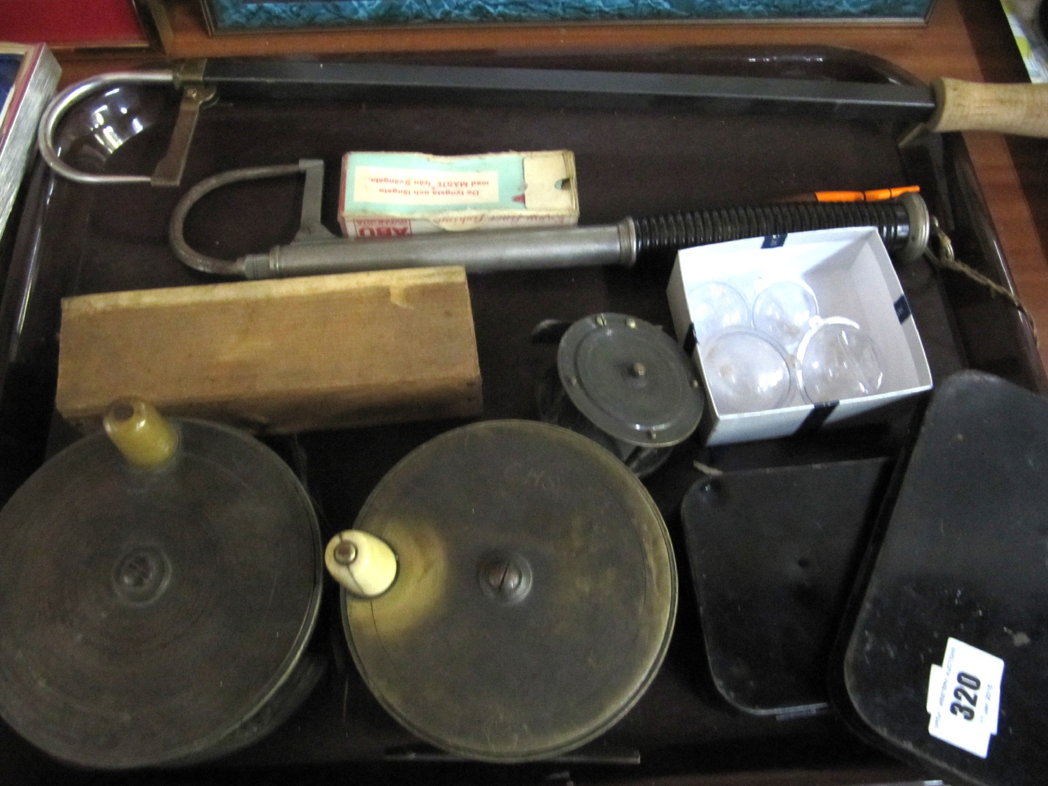 Appraisal: A lot comprising three fly fishing reels two gaffs two