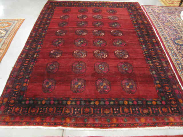 Appraisal: Baktiari Persian Handmade Rug interesting geometric medallion on rich burgundy