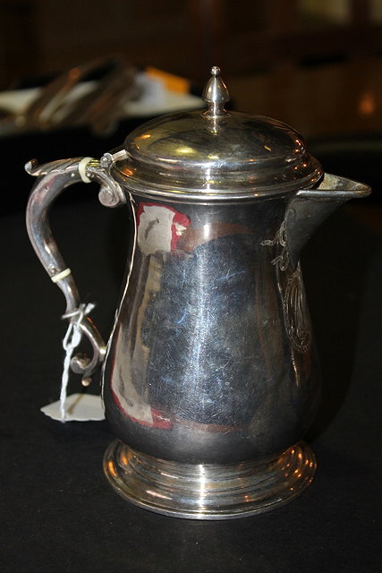 Appraisal: A GEORGIAN SILVER LIDDED JUG of baluster form with shaped