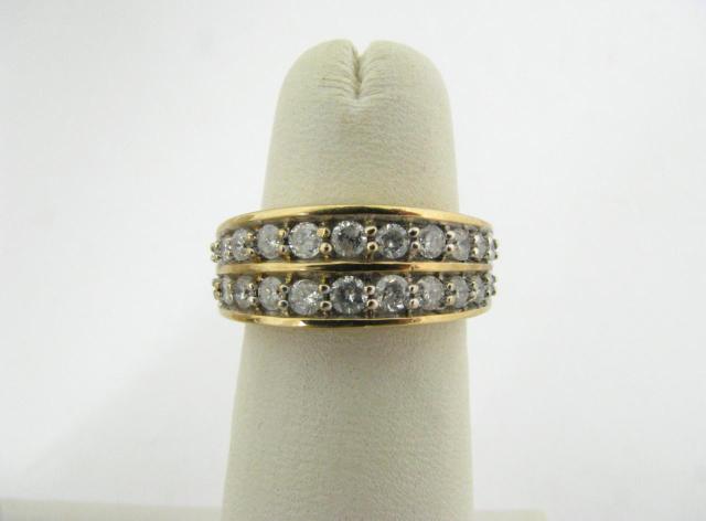 Appraisal: K Yellow gold ring with twenty-two round channel set diamonds