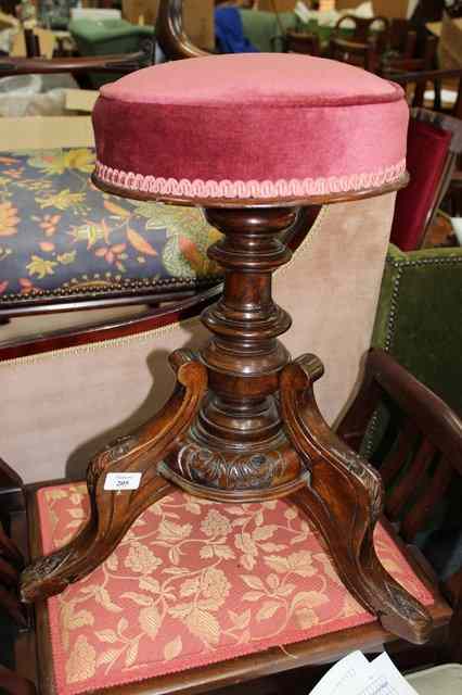 Appraisal: A VICTORIAN POSSIBLY WALNUT PIANO STOOL with overstuffed upholstered seat