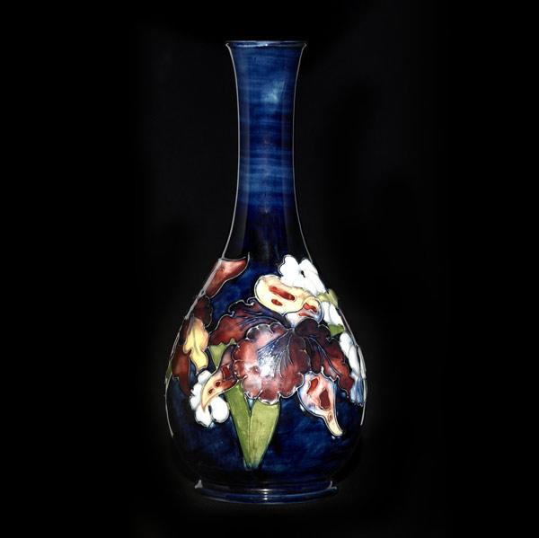 Appraisal: MOORCROFT Vase in the Orchid pattern on indigo ground Stamped