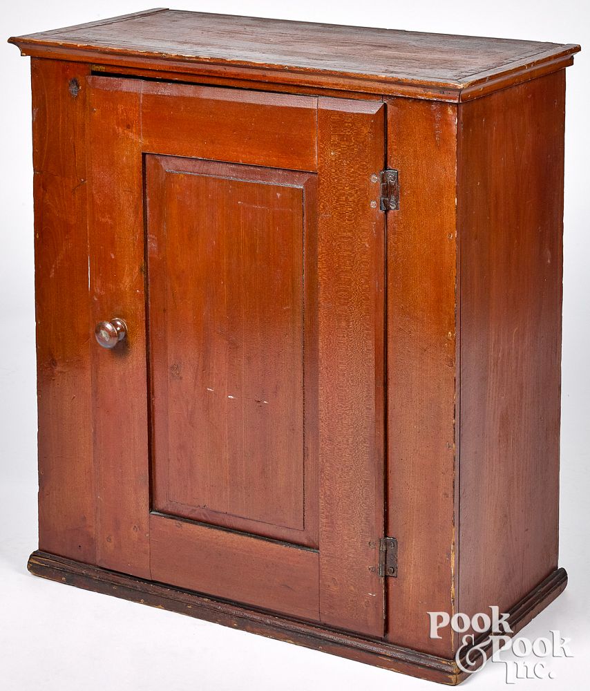 Appraisal: Pennsylvania stained poplar hanging cupboard Pennsylvania stained poplar hanging cupboard