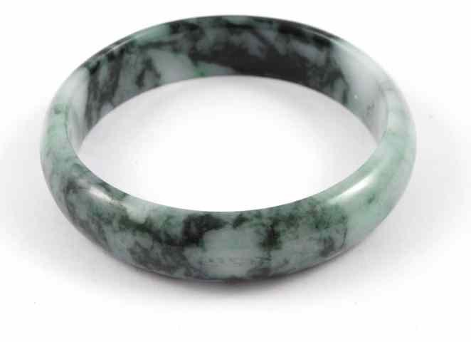 Appraisal: CHINESE GREEN JADE BANGLE round in shape having shades of