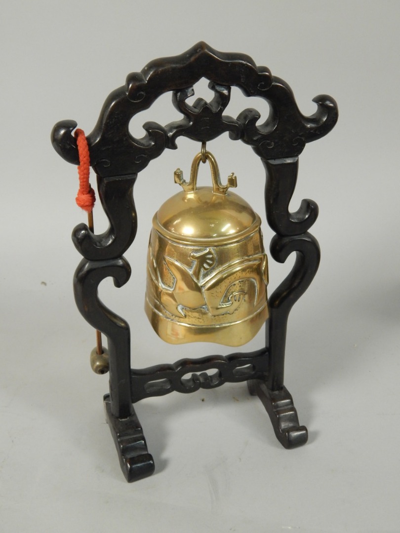 Appraisal: A Chinese bronze gong on a carved hardwood stand cm