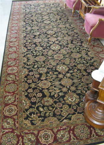 Appraisal: HAND KNOTTED ORIENTAL FOYER CARPET Indo-Persian overall floral raceme decoration