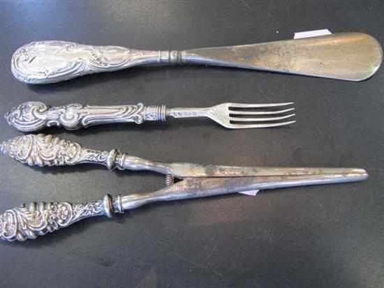 Appraisal: THREE STERLING SILVER HANDLED ITEMS INCL GLOVE EXPANDERS AND SHOE