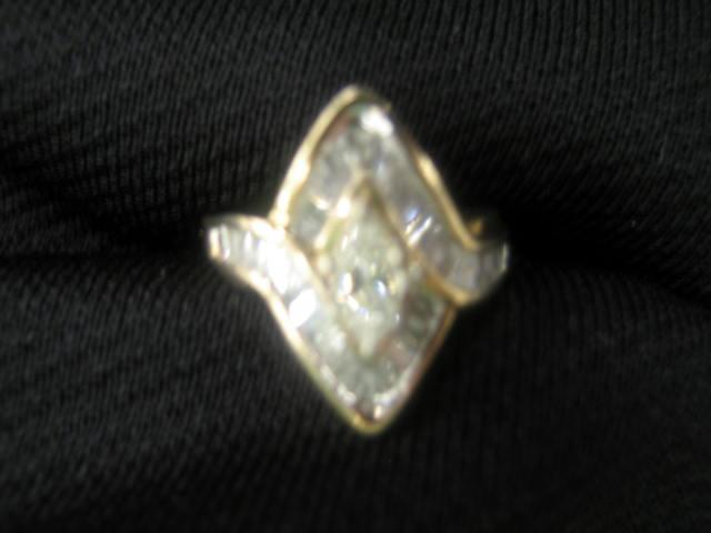 Appraisal: Diamond Ring marquise carat center stone surrounded by baguette diamonds