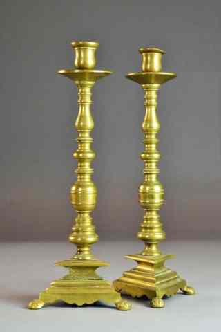 Appraisal: Pr AMERICAN BRASS CANDLESTANDSGraduated ball form column on stepped triangular