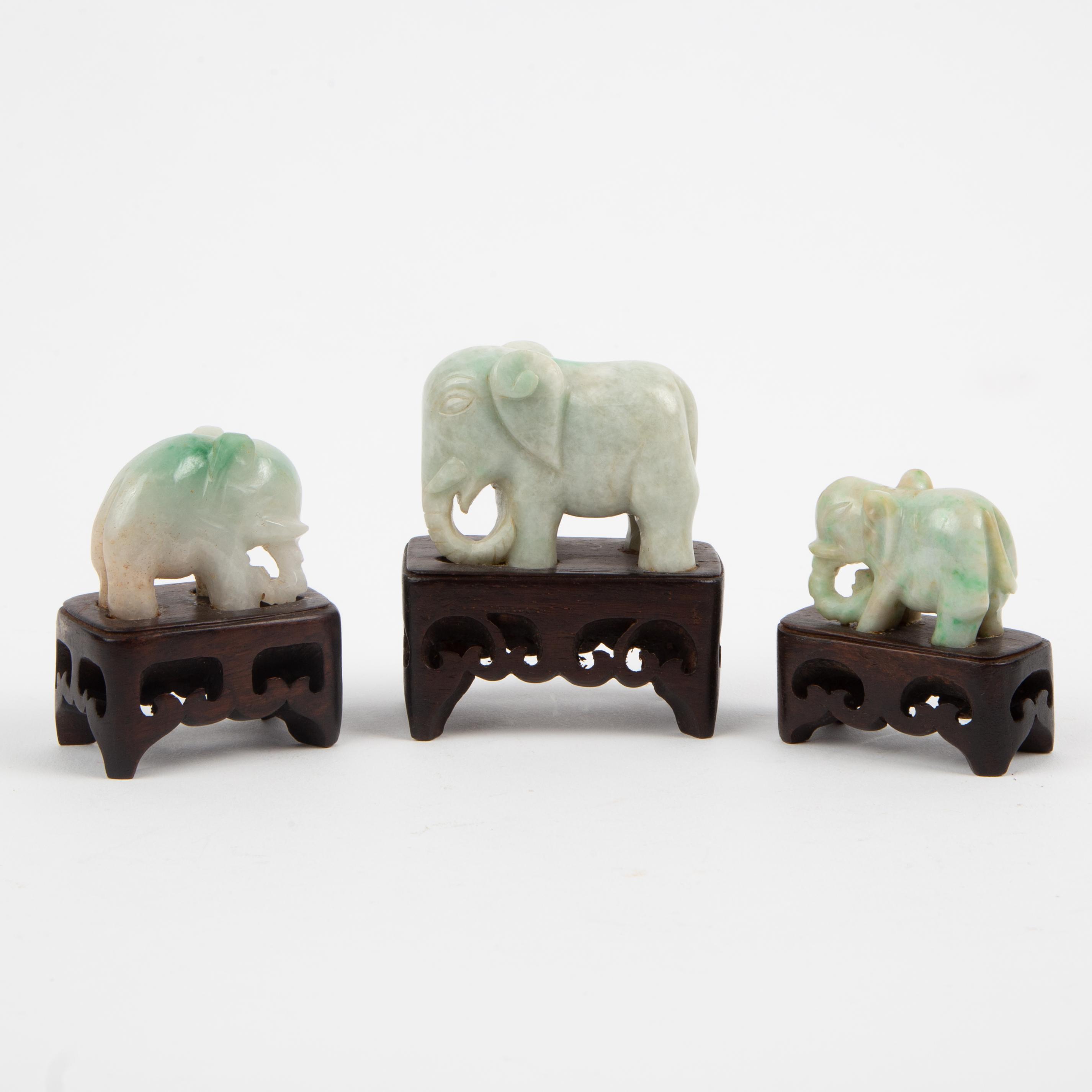 Appraisal: CHINESE CARVED CELADON JADEITE JADE ELEPHANTS TH C Three elephants