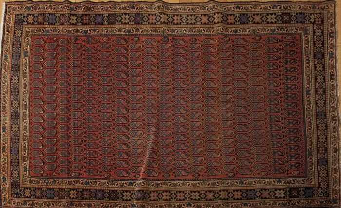 Appraisal: NORTHEAST PERSIAN RUG The wine red field worked with pinecones