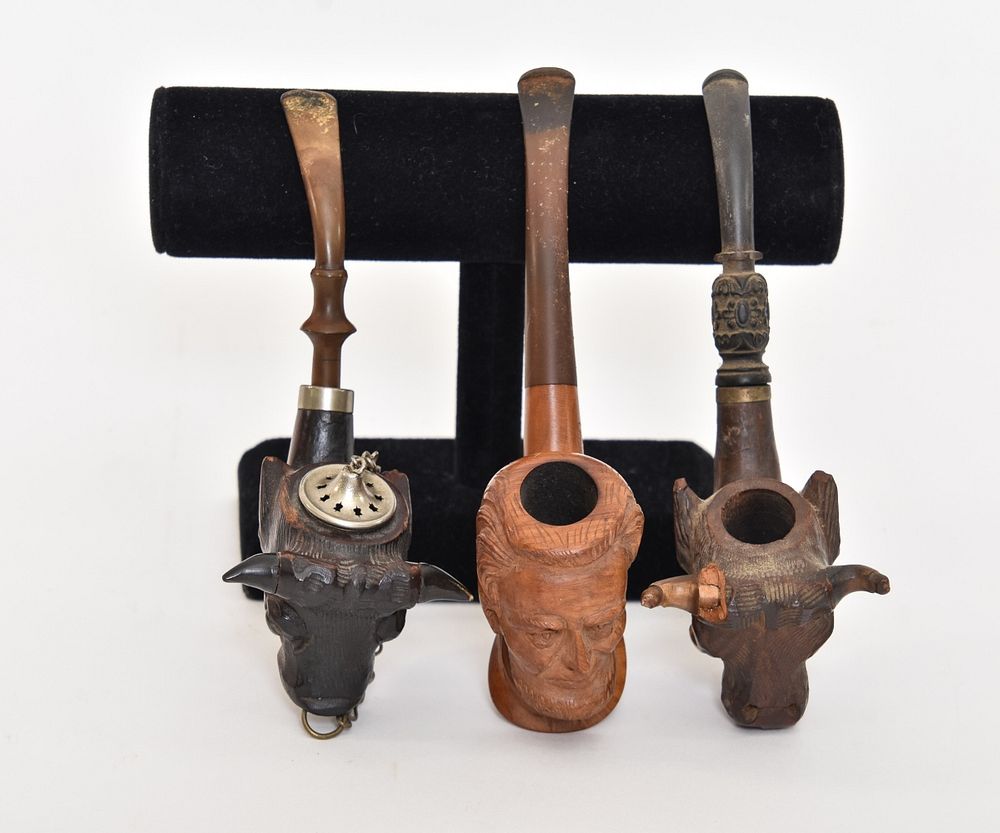 Appraisal: Three Carved Smoking Pipes Three carved smoking pipes Algerian Briar