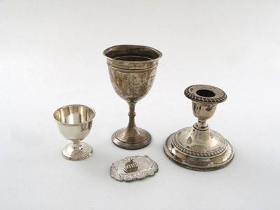 Appraisal: A mixed lot three taper sticks two small trophy cups