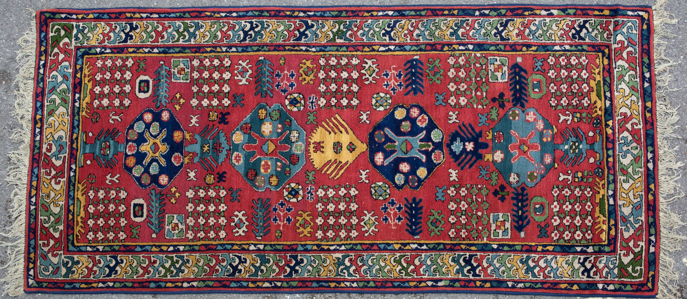 Appraisal: A Tetex red ground runner with stylised floral design to