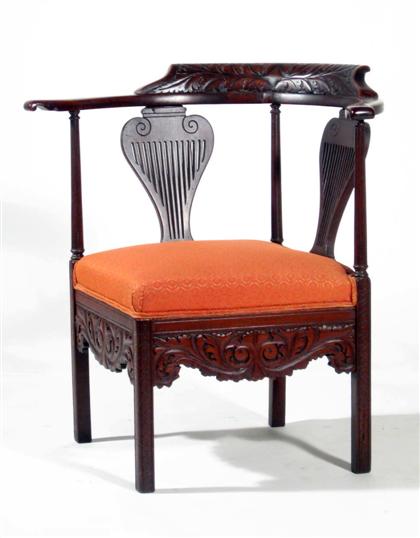 Appraisal: Stained Chippendale-style corner chair Carved shaped crest over shaped arms