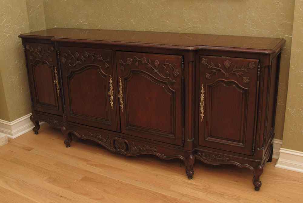 Appraisal: CENTURY FURNITURE CARVED SIDEBOARD Shaped top over floral design carved