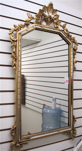 Appraisal: AN ITALIAN GILT WOOD HAND CARVED WALL MIRROR with mirror