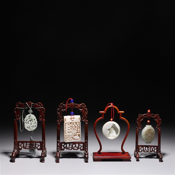 Appraisal: Group of four Chinese jade or hardstone carvings each hung