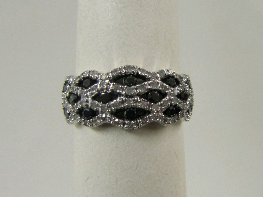 Appraisal: Nine carat white gold black and white diamond set dress