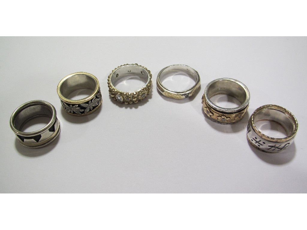 Appraisal: Six silver dress rings with gold onlay