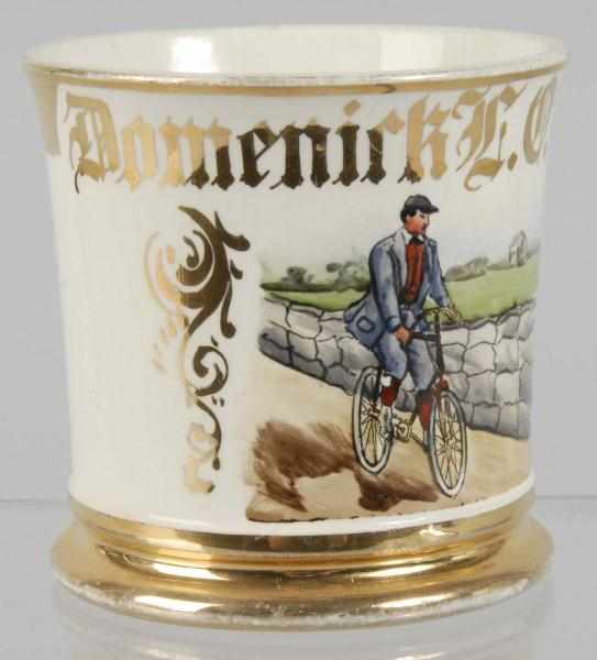 Appraisal: Man Riding Bicycle Shaving Mug Description Stamped K T Co