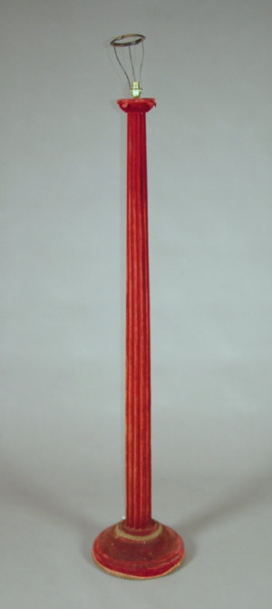 Appraisal: A red velvet covered standard lamp with fluted column upon