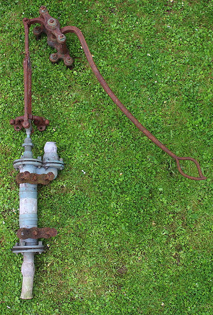 Appraisal: A VICTORIAN IRON AND BRONZE WELL PUMP with wrought iron