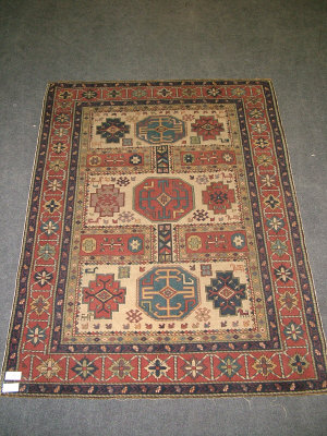 Appraisal: A Shirvan rug with octagons and step edged medallions in