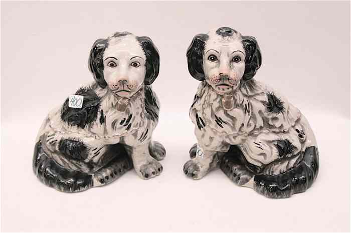 Appraisal: STAFFORDSHIRE STYLE POTTERY DOGS in opposing positions with black spots