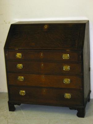 Appraisal: A GEORGE III OAK BUREAU early th century the fallfront