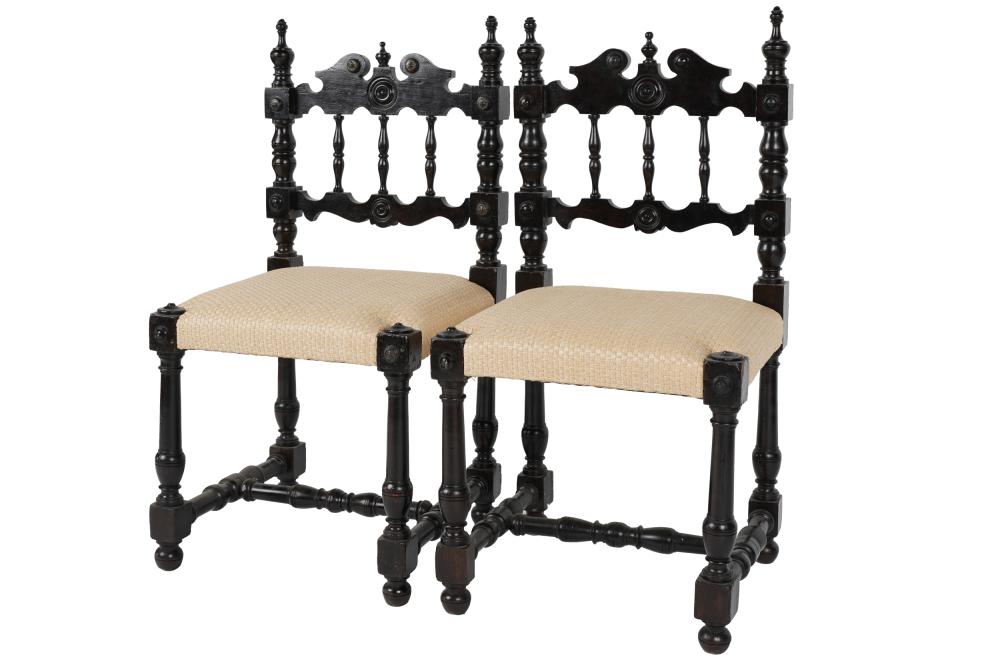 Appraisal: PAIR OF SPANISH COLONIAL- STYLE EBONIZED CHAIRScovered with natural-colored woven