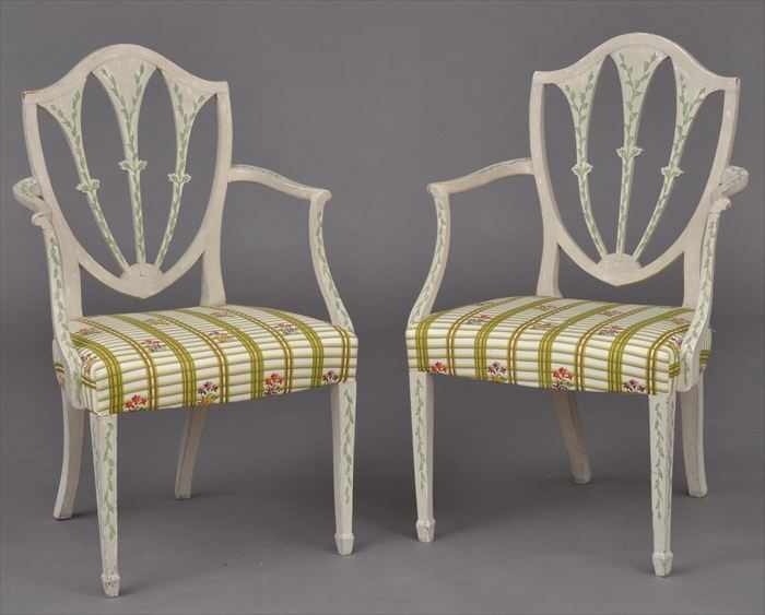 Appraisal: PAIR OF GEORGE III IVORY-PAINTED SHIELD-BACK ARMCHAIRS Each pierced backrest