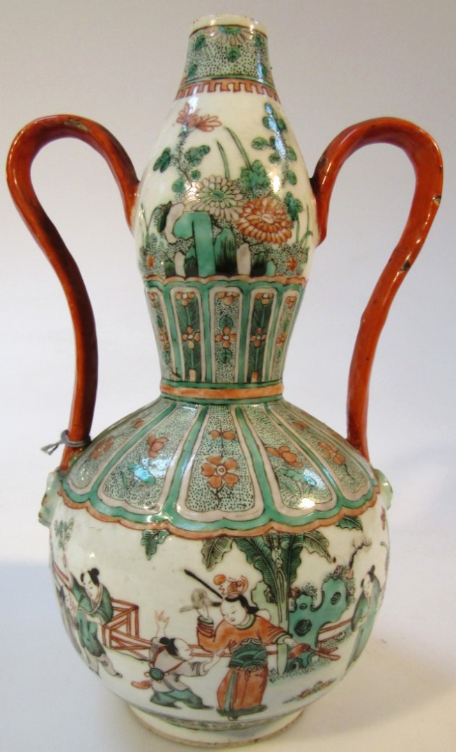 Appraisal: A Chinese porcelain Ming gourd vase with shaped handles polychrome