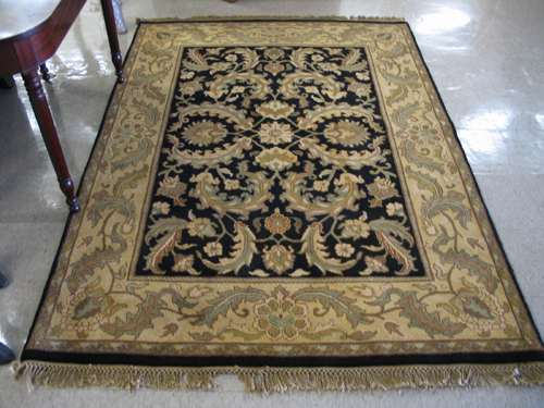 Appraisal: DECORATIVE ORIENTAL CARPET Indo-Persian having a rectangular black field filled