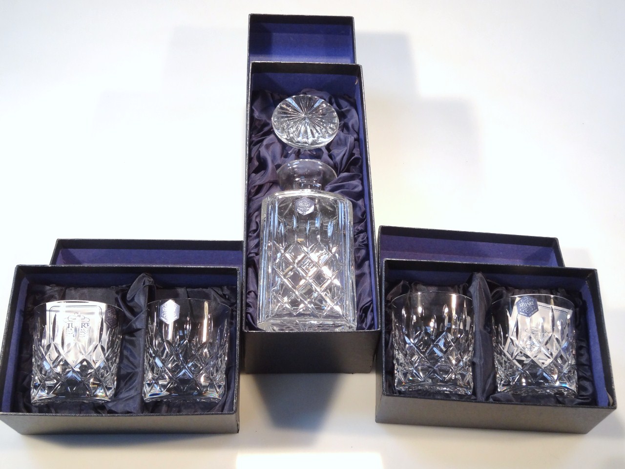 Appraisal: A thC Stuart Crystal boxed decanter and tumbler set each