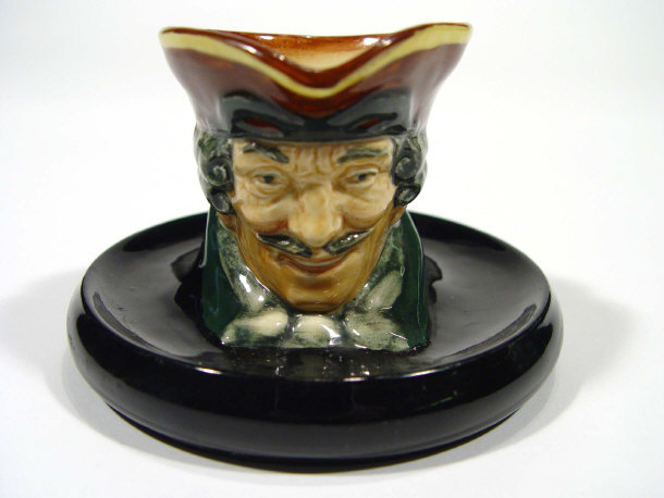 Appraisal: Royal Doulton match striker in the form of a Cavalier