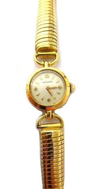 Appraisal: A lady's gold circular cased Movado bracelet wristwatch the signed