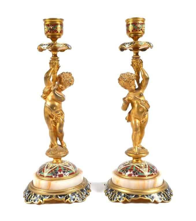 Appraisal: PAIR OF CHAMPLEVE AND GILT BRONZE CANDLESTICKSAntique pair of French