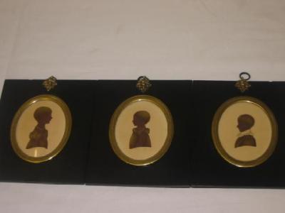 Appraisal: FOSTER Silhouette portraits of children set of three watercolours with