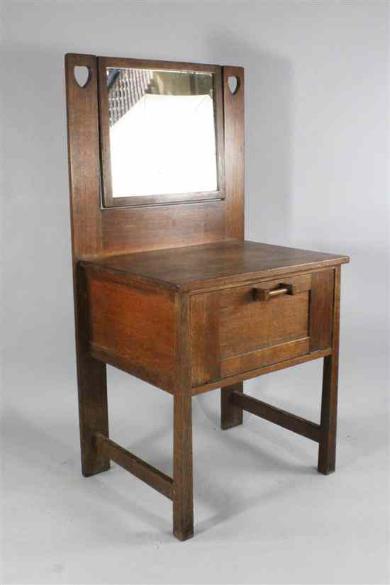 Appraisal: A Leonard Wyburd for Liberty and Co oak dressing table