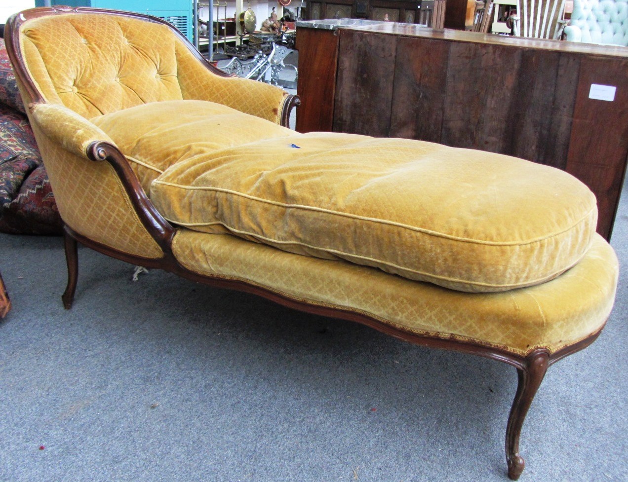 Appraisal: A late th century stained beech tub back chaise longue