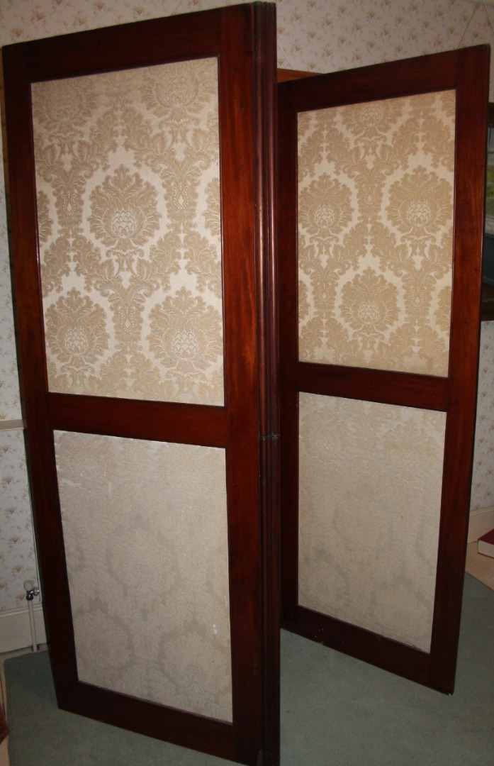 Appraisal: A Victorian mahogany three fold dressing screen with damask panels