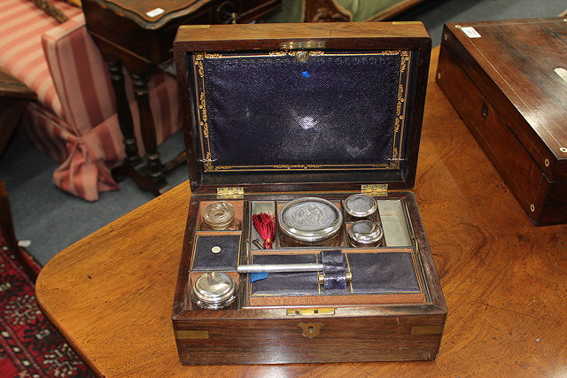 Appraisal: A VICTORIAN MAHOGANY DRESSING BOX with brass mounts the interior