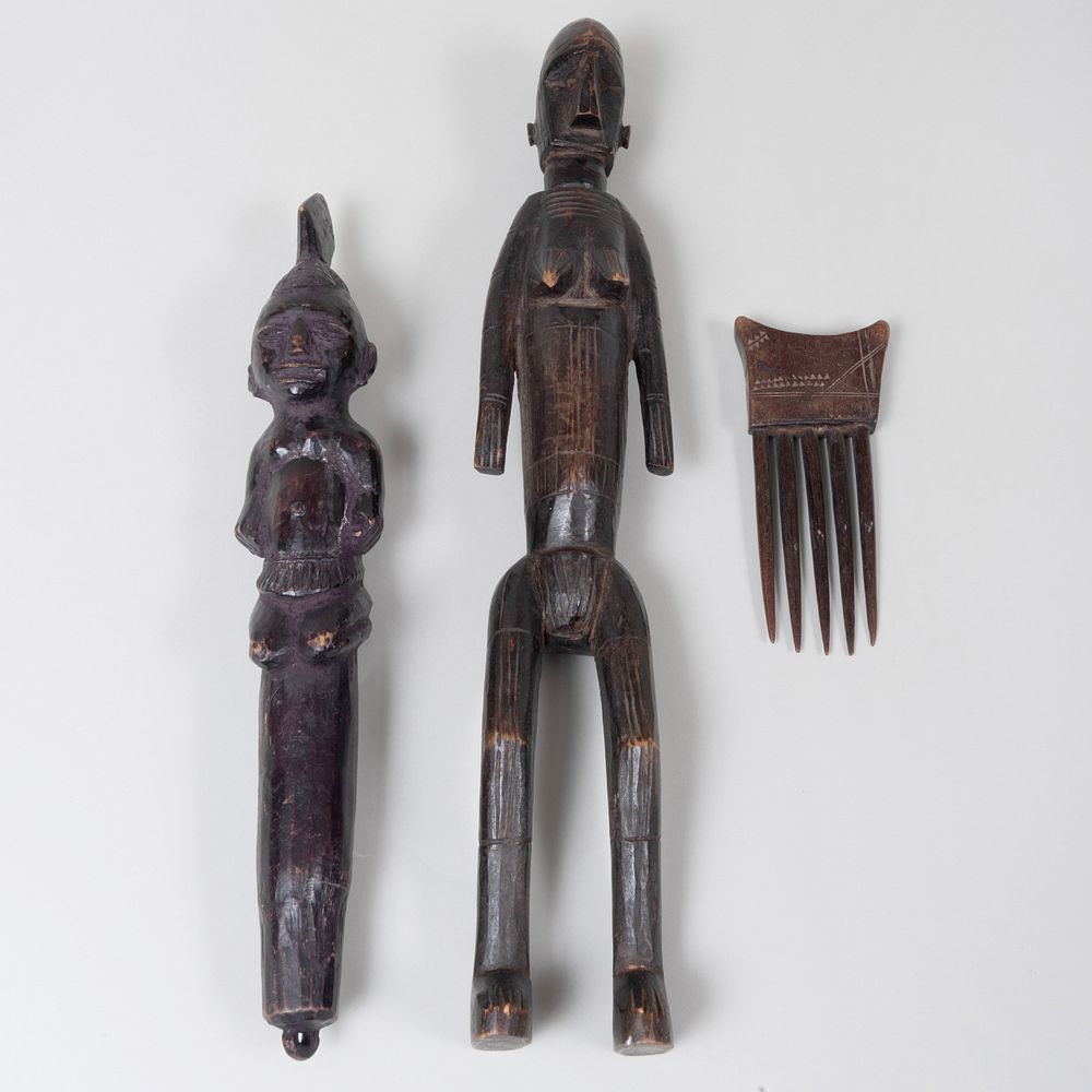 Appraisal: Three African Wood Artifacts Comprising A reliquary figure A staff