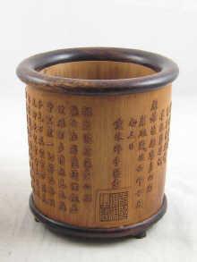 Appraisal: A Chinese bamboo brush pot with caligaphic decoration cm diameter